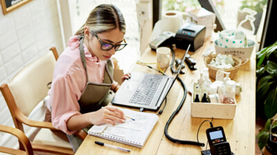 A female business owner working on the company’s finances.