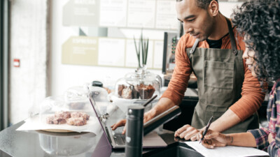 Small business owners reviewing the business’ finances and evaluating tax strategies.