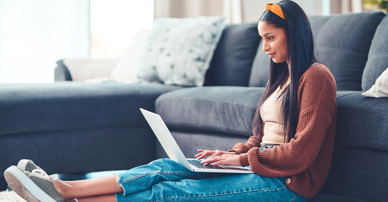 A woman using a laptop computer.