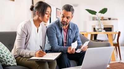 Man and woman paying bills.