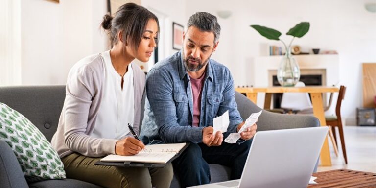 Man and woman paying bills.