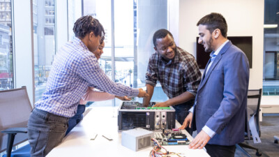 Tech Impact students working on a computer.