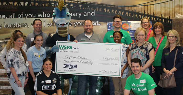 The WSFS Bank team presenting a check for $5,000 to CityTeam Chester.