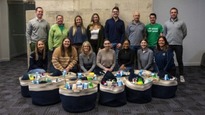 WSFS Team Members posing in front of donated items.