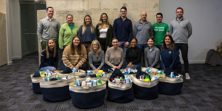 WSFS Team Members posing in front of donated items.