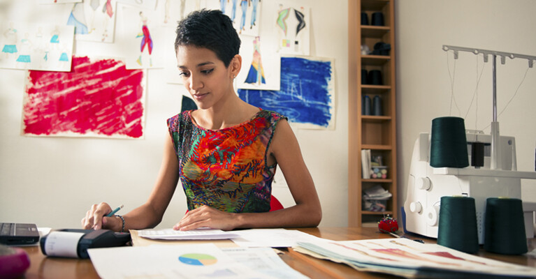 Woman looking at paperwork.