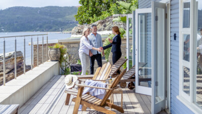 A couple meeting with a real estate agent.