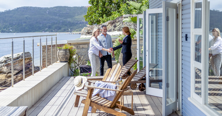 A couple meeting with a real estate agent.