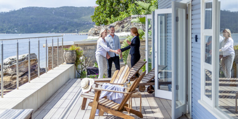 A couple meeting with a real estate agent.