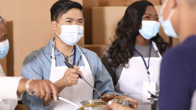 Volunteers serving food.