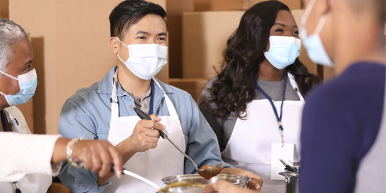 Volunteers serving food.