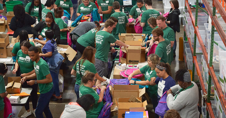 WSFS Associates packing school supplies into boxes.