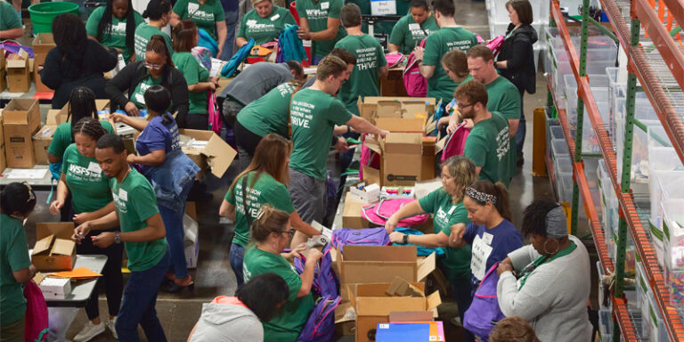 WSFS Associates packing school supplies into boxes.