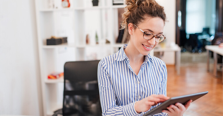 A woman using a tablet.