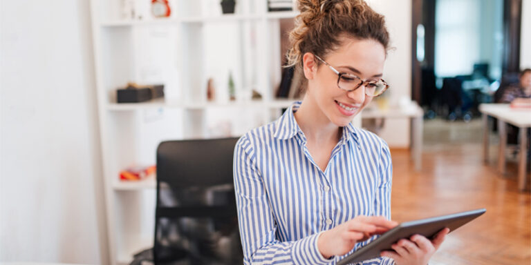 A woman using a tablet.