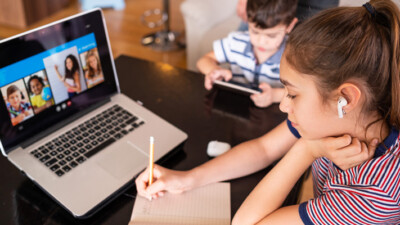 Teenage girl attending a digital class.