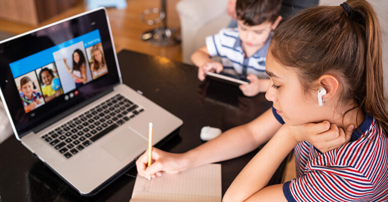 Teenage girl attending a digital class.