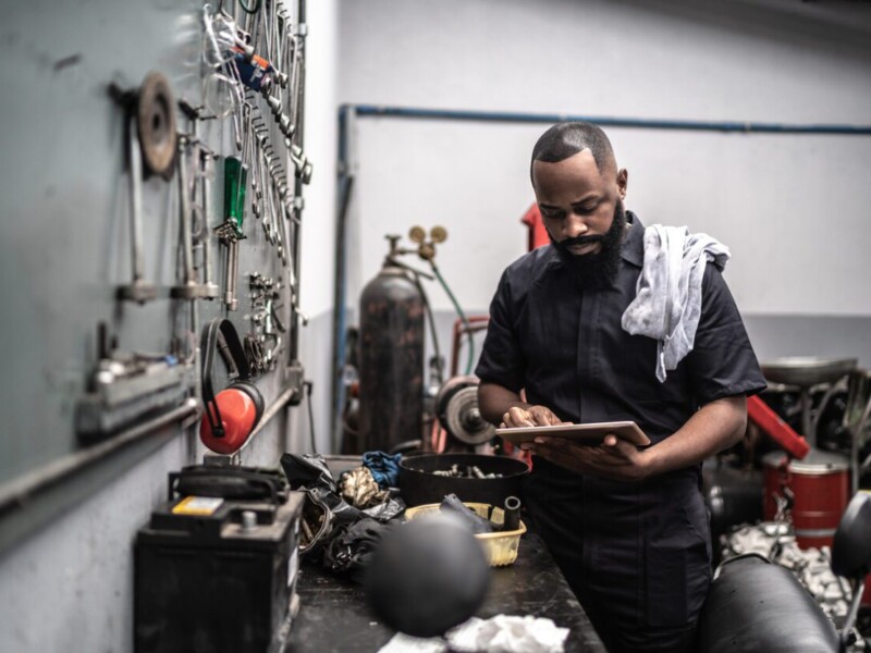 Mechanic using tablet.