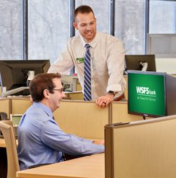 Joe O’Fria, Deposit Services Manager, collaborating with another WSFS Associate.