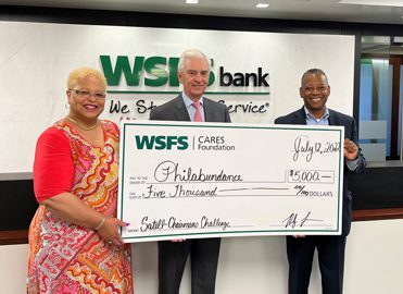 WSFS Associates present a giant check for $5,000 to Philabundance.