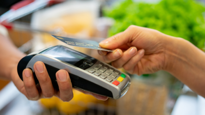 A credit card transaction being made with a handheld point-of-sale system.