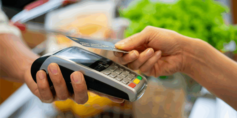 A credit card transaction being made with a handheld point-of-sale system.