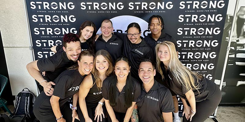 Rico Macaraeg and the STRONG Pilates team celebrate the grand opening of the new studio.