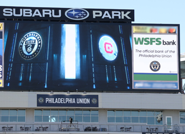 The scoreboard at Subaru Park with an ad that reads “WSFS Bank, the official bank of the Philadelphia Union.”