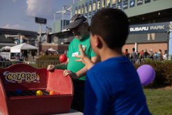 A WSFS Associate working a game at the Philadelphia Union Backpack Carnival.