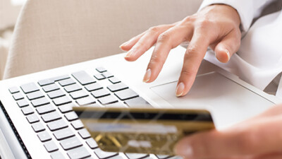 A person making an online purchase using a credit card.