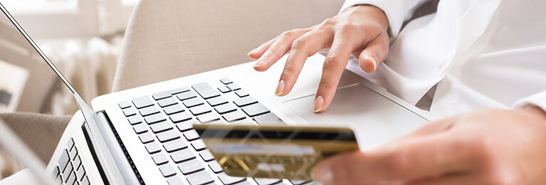 A person making an online purchase using a credit card.