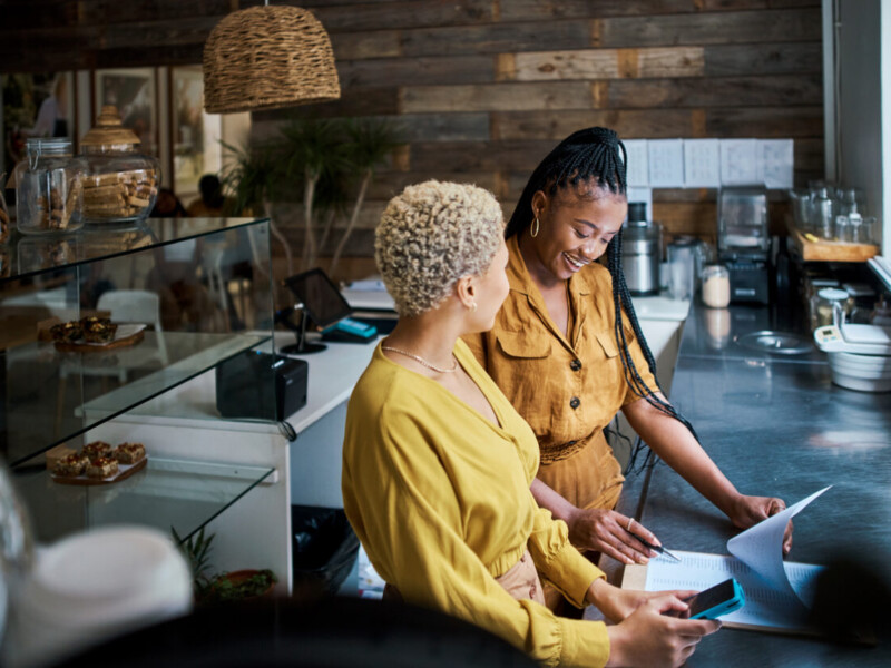 Two women business owners in their cafe.