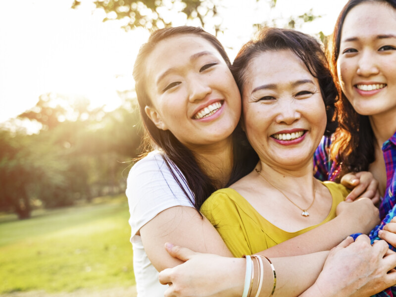 A mother and her two daughters.