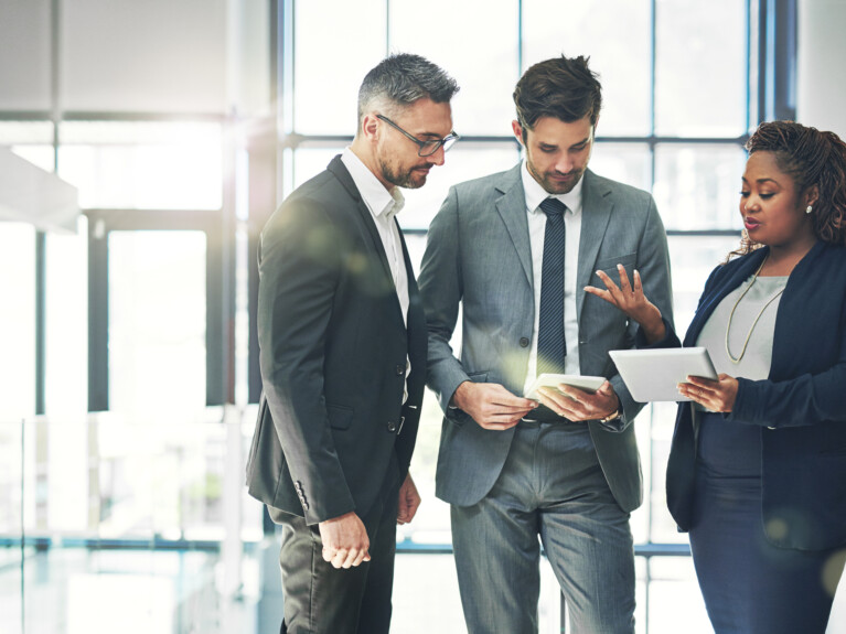 Three businesspeople having a discussion.