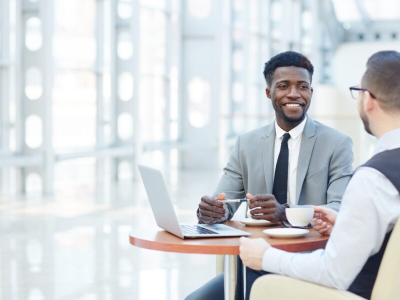 Two businessmen conversing.