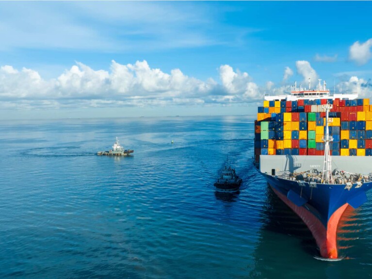 Capital Markets | Cargo ship at sea.