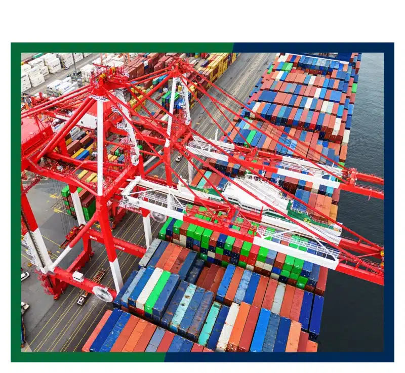 Shipping containers and cranes at a port.