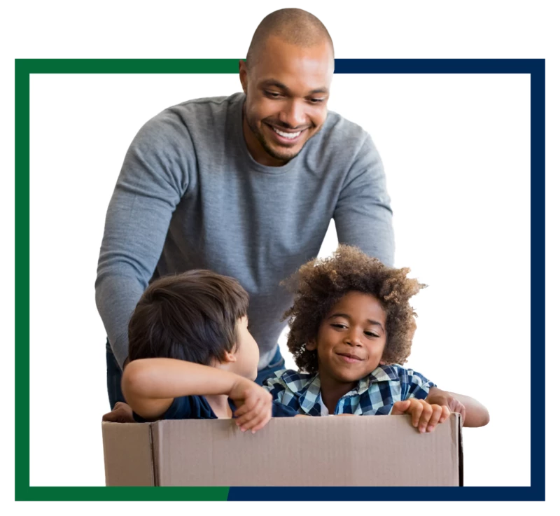 A family playing with a moving box.