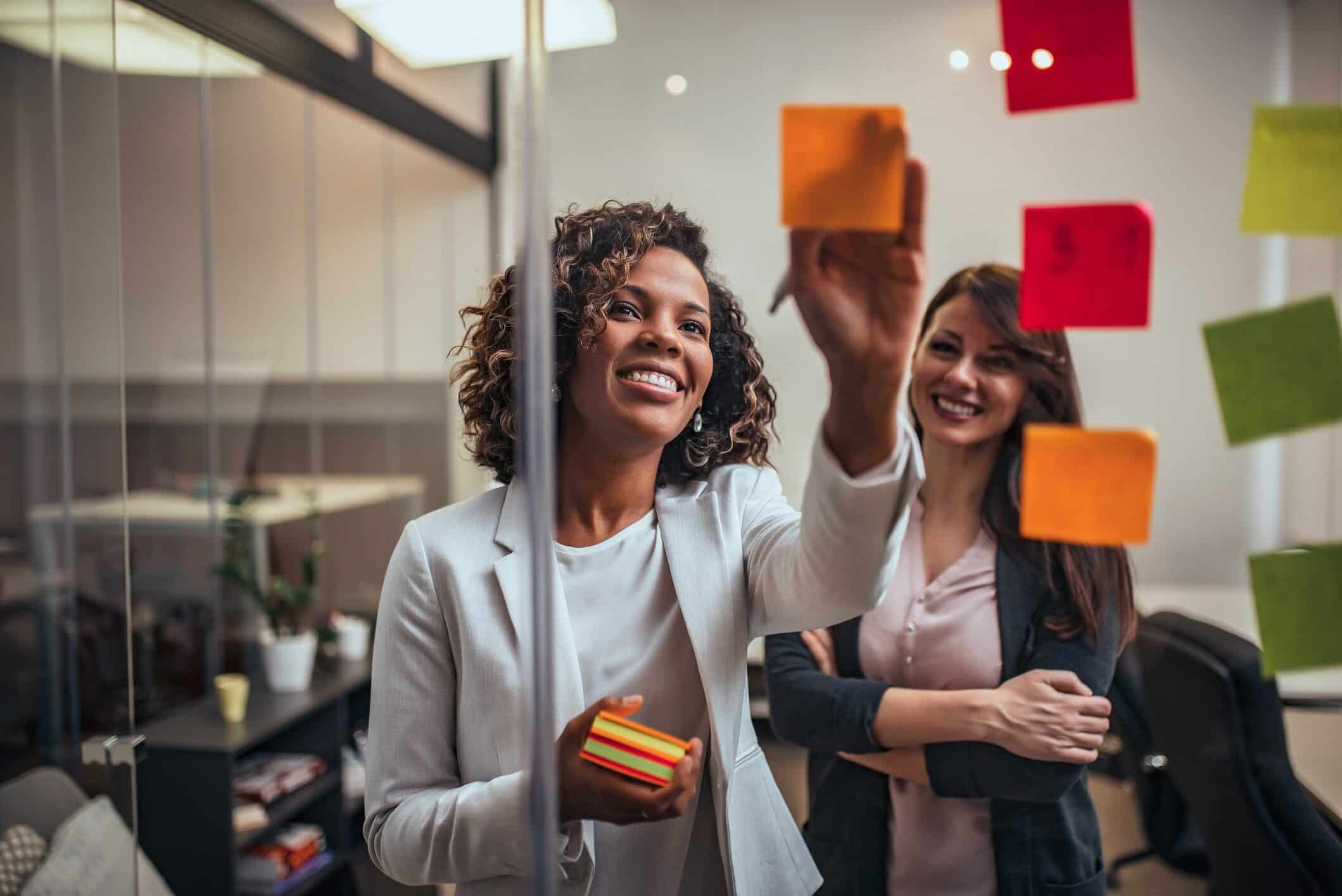 Woman brainstorming on post it notes