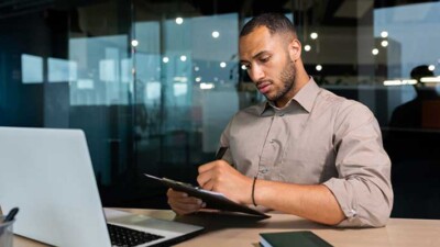 A man looking at a laptop.