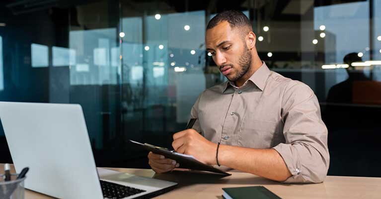 A man looking at a laptop.