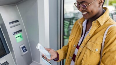 A woman using an ATM.