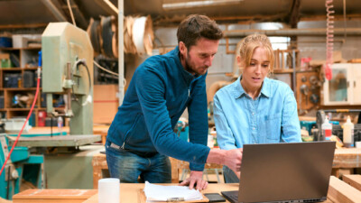 Two business people working on a computer