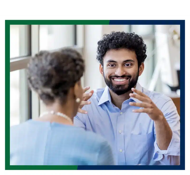 Man speaking to a businsesswoman.