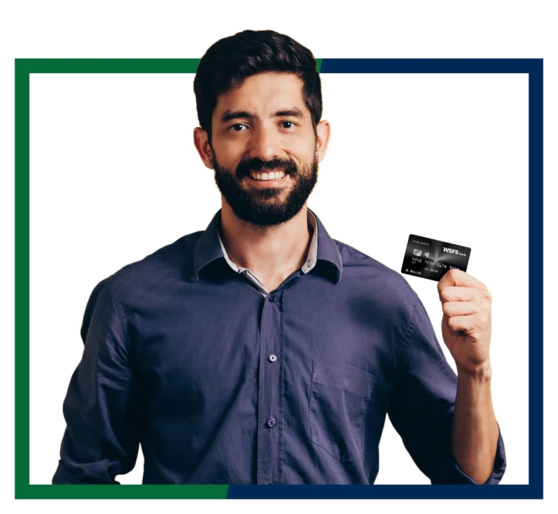 A man holding WSFS business credit card.