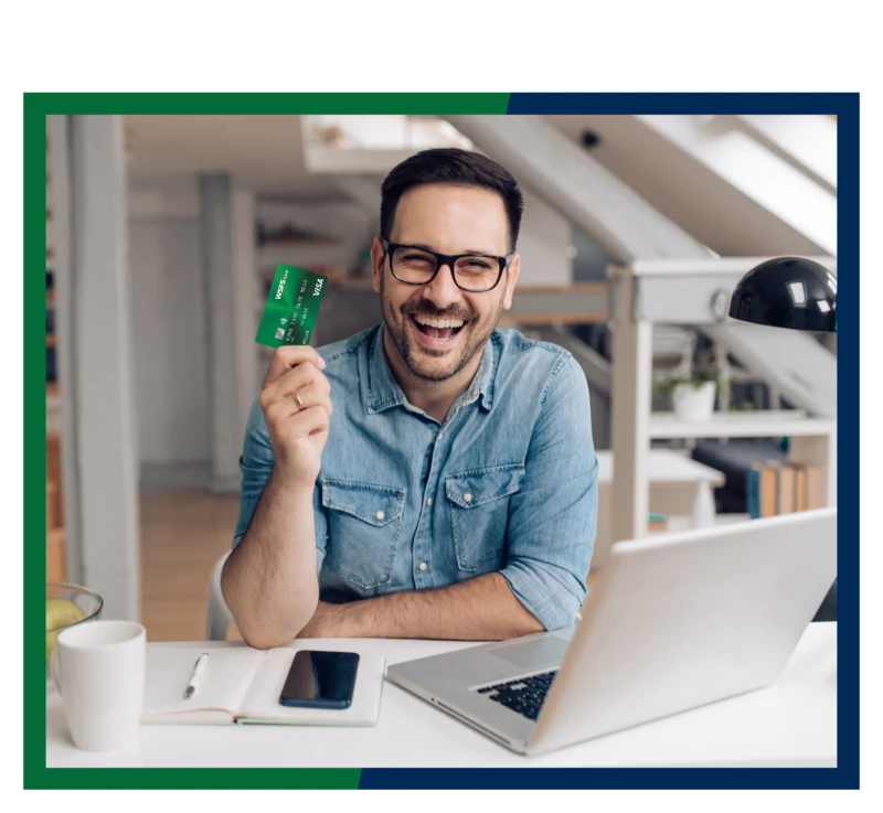 A man holding WSFS Platinum credit card.