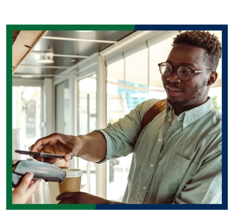 A man making a digital payment with his phone.