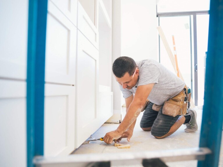 Man making repairs on his home.