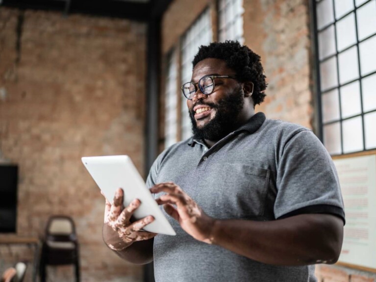 Business Online & Mobile Banking | Man using a tablet.