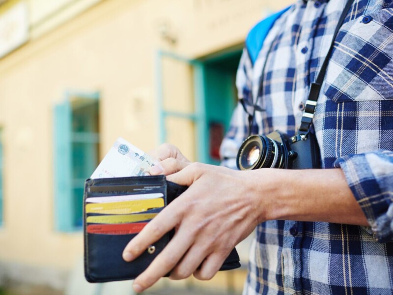 Man holding wallet.